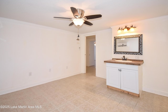 bathroom with ornamental molding, a ceiling fan, vanity, baseboards, and tile patterned floors