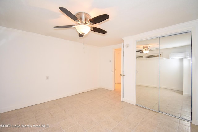 unfurnished bedroom featuring ornamental molding, a closet, ceiling fan, and baseboards