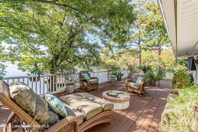 wooden deck featuring a fire pit