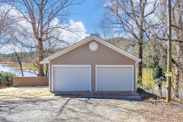 detached garage with a water view