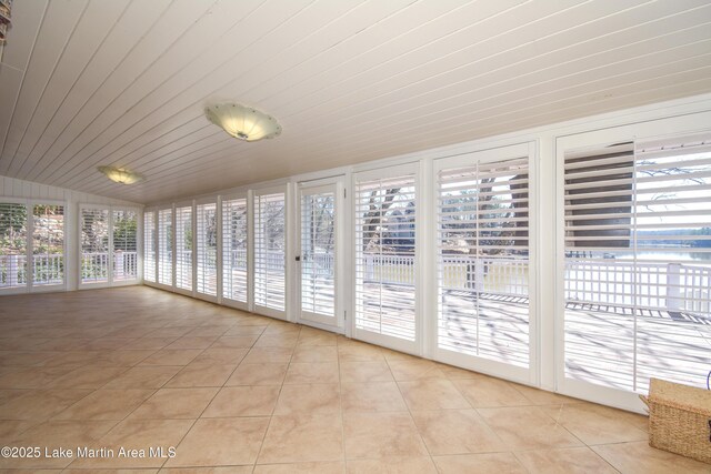 unfurnished sunroom featuring wood ceiling