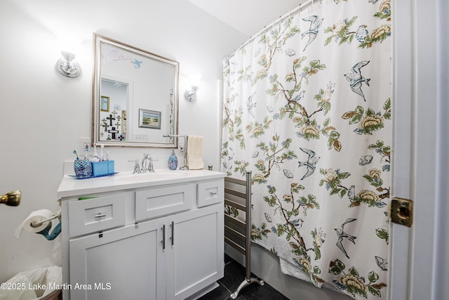 full bathroom with curtained shower and vanity