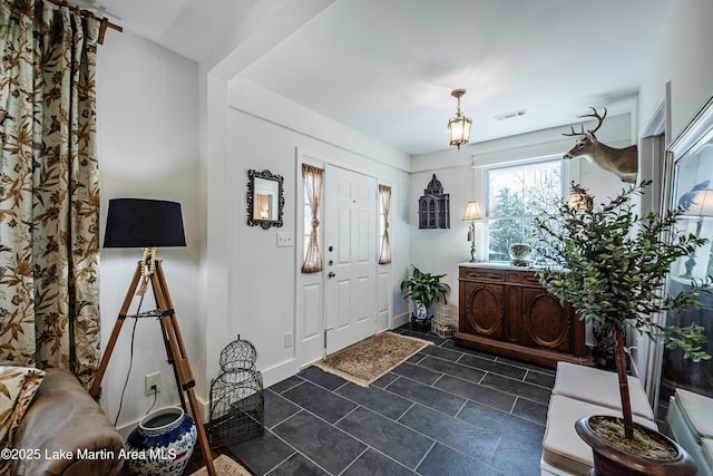 entryway featuring visible vents and baseboards