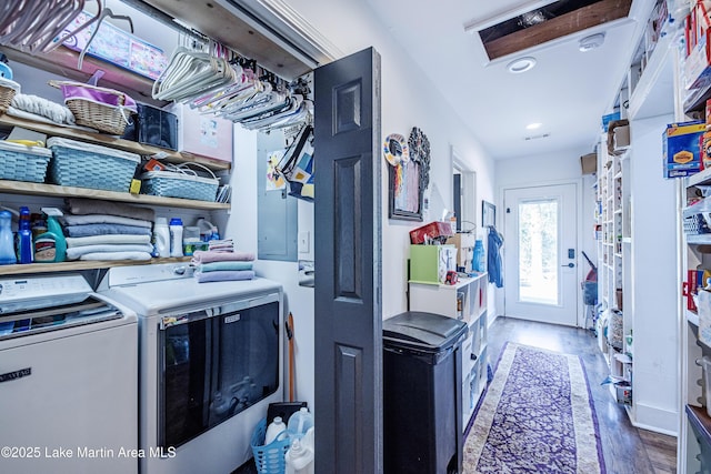 clothes washing area with recessed lighting, wood finished floors, washing machine and dryer, and laundry area