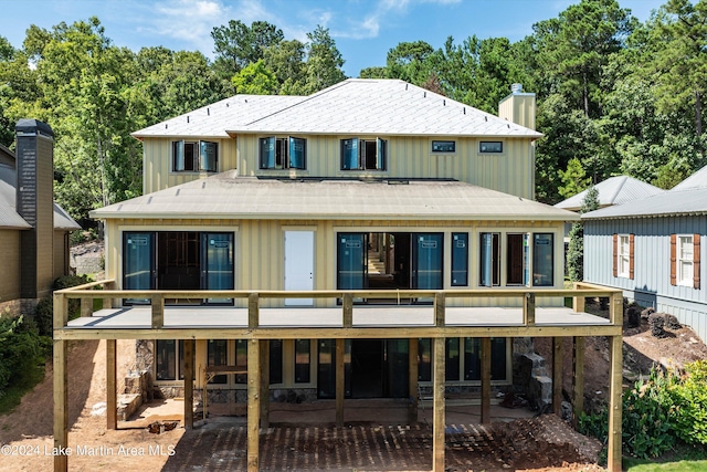 rear view of house featuring a balcony