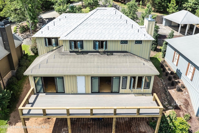 back of property featuring a carport