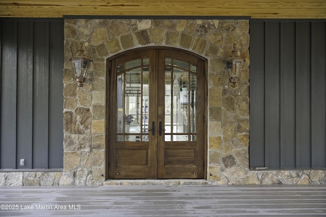 view of exterior entry featuring french doors