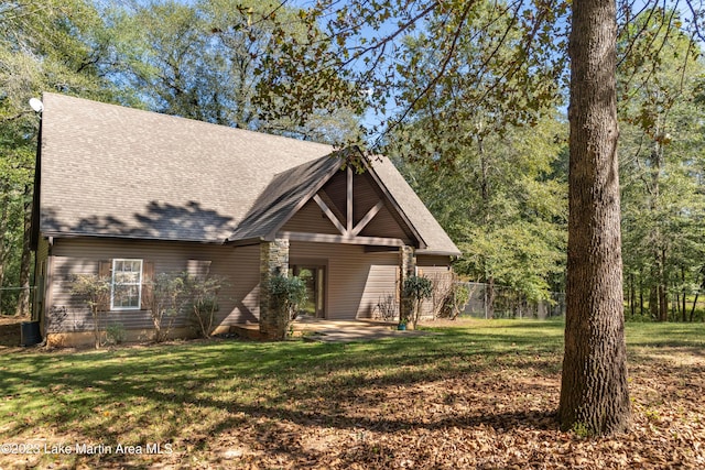 view of front of property featuring a front lawn and a patio