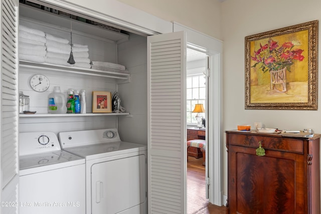 laundry room featuring independent washer and dryer and wood-type flooring