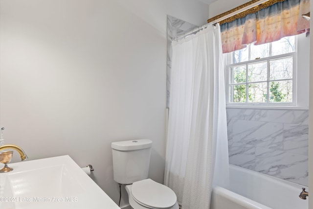 full bathroom with shower / bathtub combination with curtain, sink, and toilet