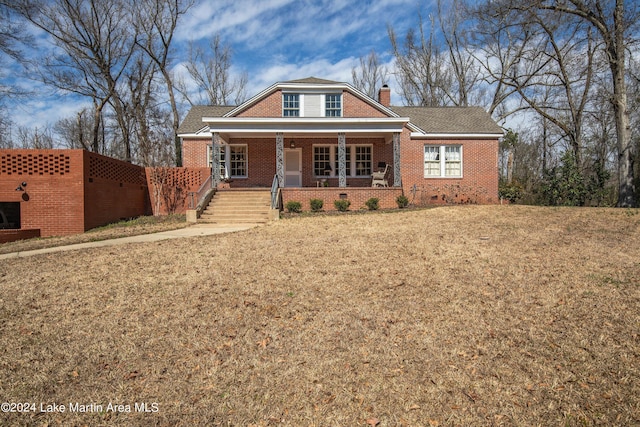 view of front of house featuring a porch and a front yard