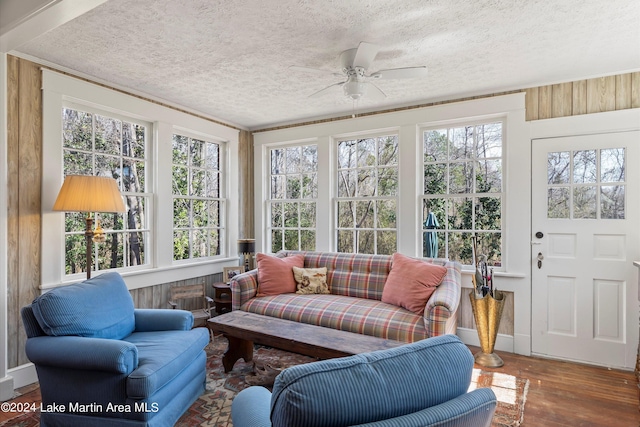 sunroom / solarium with ceiling fan and a healthy amount of sunlight