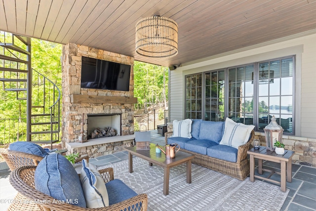 view of patio / terrace featuring an outdoor living space with a fireplace