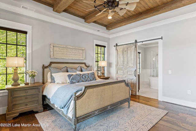 bedroom with connected bathroom, ceiling fan, a barn door, wood ceiling, and hardwood / wood-style flooring