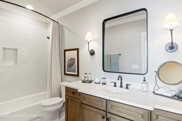 full bathroom featuring vanity, shower / bath combination with curtain, and toilet