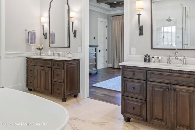 bathroom featuring plus walk in shower, vanity, and hardwood / wood-style flooring