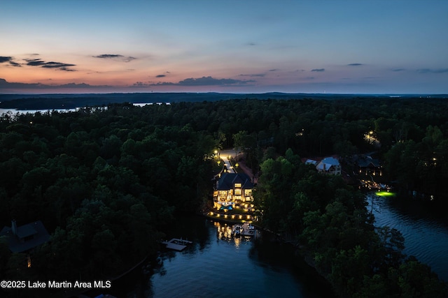 aerial view at dusk with a water view