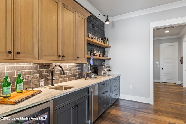 bar featuring sink, wine cooler, crown molding, and light stone counters