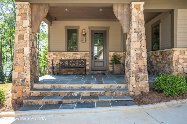 property entrance featuring covered porch