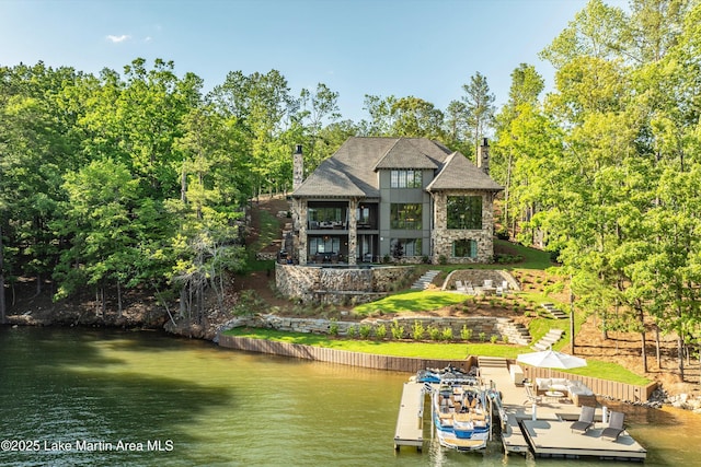 rear view of house with a water view