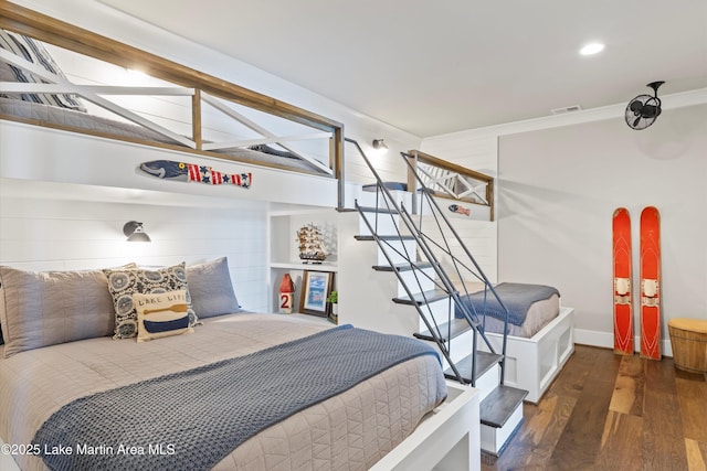 bedroom with dark hardwood / wood-style floors