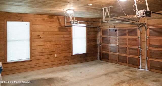 garage featuring wood walls and wood ceiling