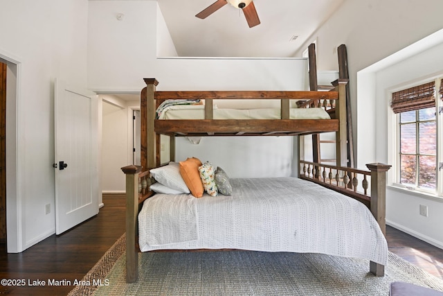 bedroom featuring wood finished floors and baseboards