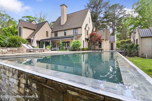 swimming pool with a patio area
