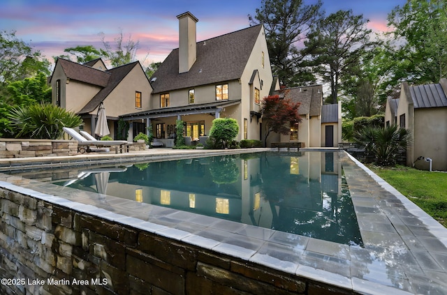 swimming pool featuring a patio area