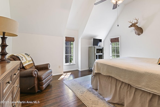 bedroom featuring vaulted ceiling, dark wood-style floors, baseboards, and a ceiling fan