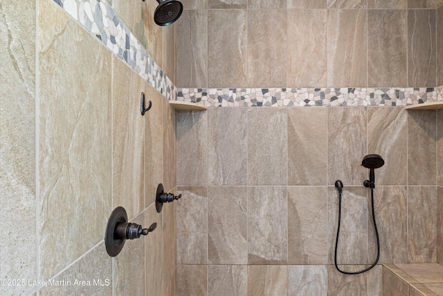 interior details with a tile shower