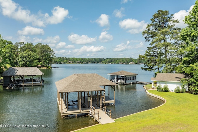 view of dock featuring a water view and a yard