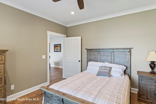 bedroom featuring ornamental molding, ceiling fan, and dark hardwood / wood-style flooring