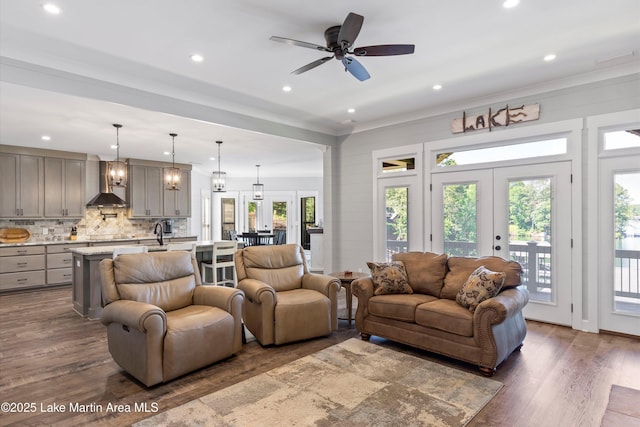 living room featuring french doors, ceiling fan, and dark wood-type flooring