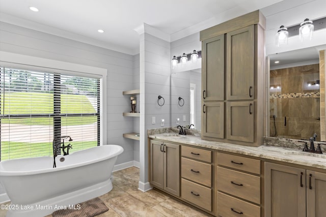 bathroom with vanity, crown molding, and independent shower and bath