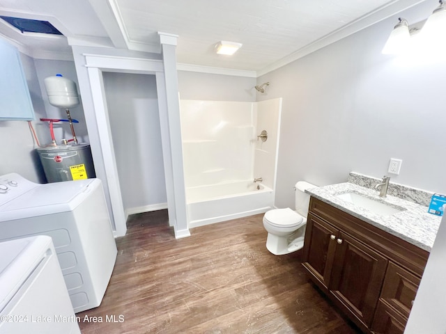 full bathroom featuring washer and clothes dryer, vanity, hardwood / wood-style floors, ornamental molding, and water heater