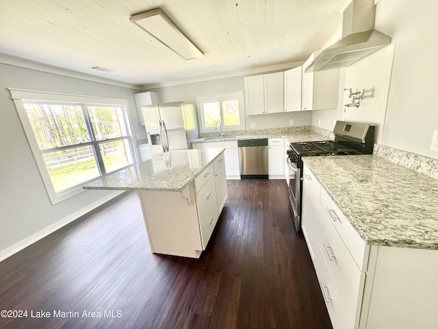 kitchen featuring a center island, range hood, appliances with stainless steel finishes, dark hardwood / wood-style flooring, and white cabinetry