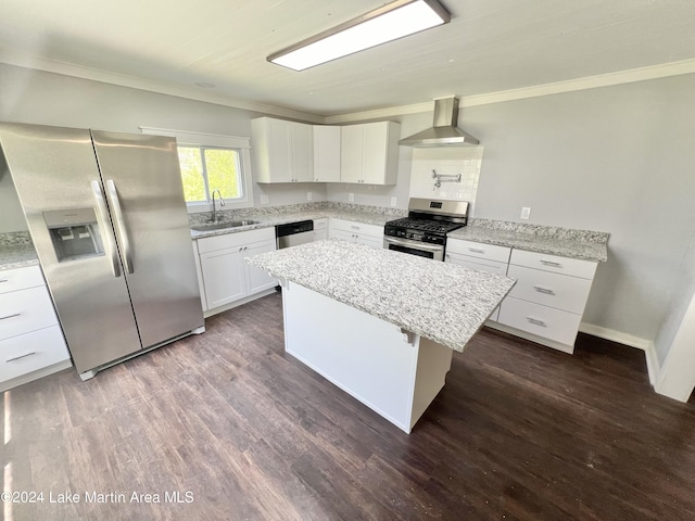 kitchen featuring white cabinetry, a center island, wall chimney exhaust hood, stainless steel appliances, and sink