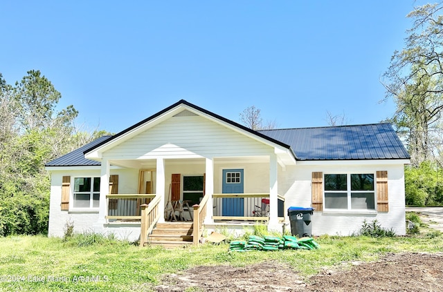 view of front of home featuring covered porch