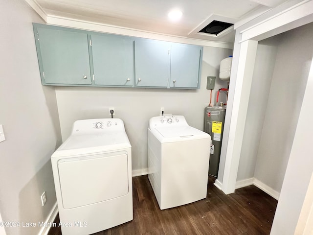 laundry area with electric water heater, dark hardwood / wood-style flooring, cabinets, and separate washer and dryer