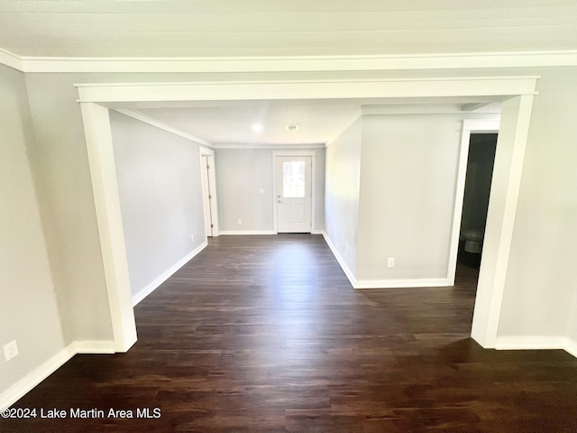 foyer with dark hardwood / wood-style floors and ornamental molding