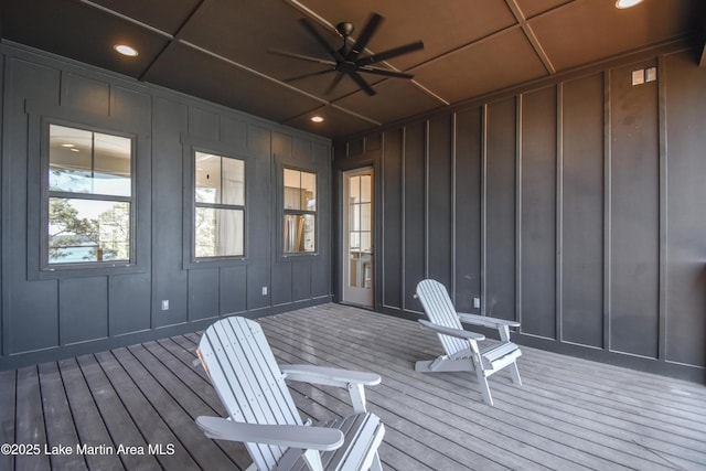 wooden deck featuring ceiling fan