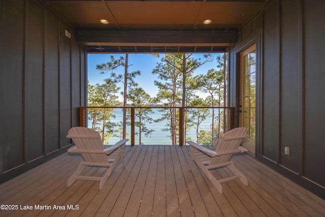 wooden deck featuring a water view