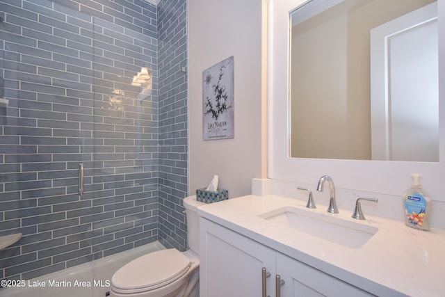 bathroom with toilet and vanity