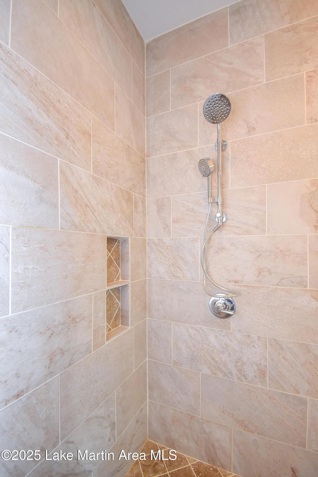 full bath with a tile shower