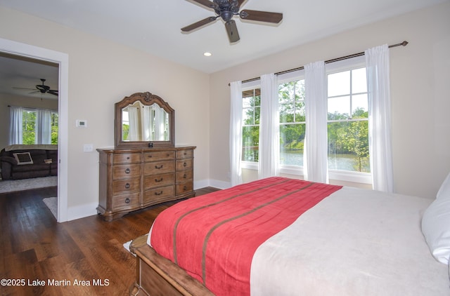 bedroom featuring baseboards, dark wood-style flooring, recessed lighting, and a ceiling fan