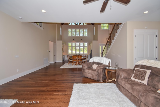 living area featuring stairway, recessed lighting, a ceiling fan, and wood finished floors