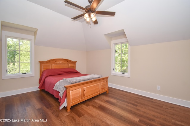 bedroom with lofted ceiling, dark wood-style flooring, baseboards, and ceiling fan