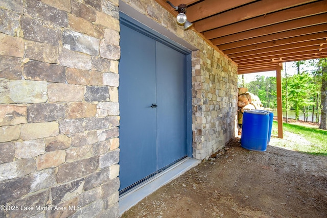 view of exterior entry with stone siding