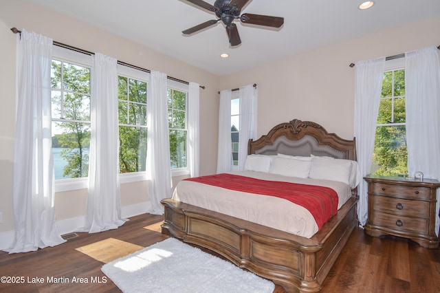 bedroom with a ceiling fan, recessed lighting, baseboards, visible vents, and dark wood-type flooring